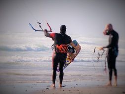 people are engaged in kiteboarding