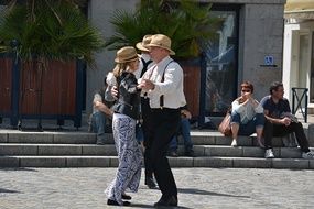 couples are dancing at the festival