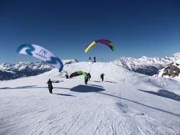 paragliding over snowy alps