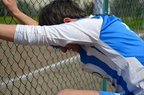 young man is doing stretching exercise