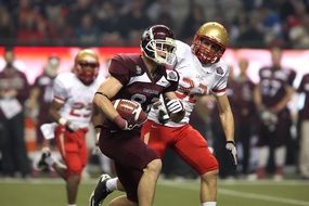 American Football players in helmet