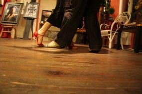 couple dancing steps on the floor