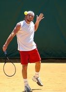 man with racket on the tennis court