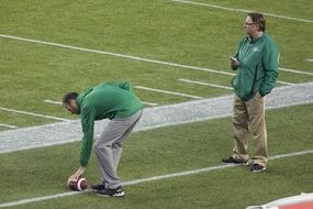 Canadian Football Coach with the ball