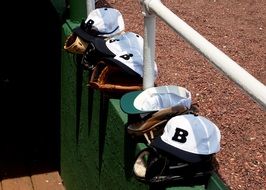 baseball gloves and caps