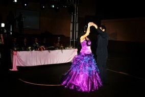 girl in a purple dress dancing in pair