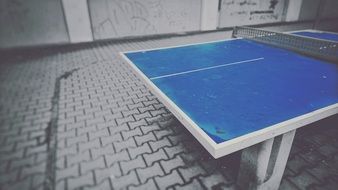 blue table tennis outdoors