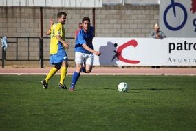 two soccer players with a ball