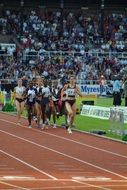 Running women on stadium, sprinter contest
