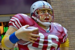 figure of uniformed American Football Player