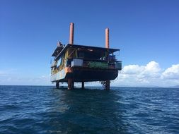 building in the sea on stilts