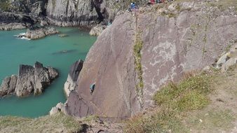 climbing rocks near the sea