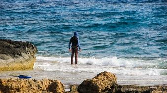 diver stands on the water