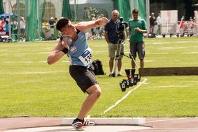 young athlete throwing a core in competition