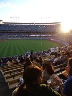 people in the stands at a baseball game