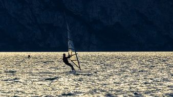 windsurfing on shiny water