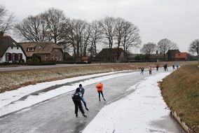 Ice Skating humans on a frozen ice