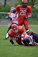 fallen american football players on the field