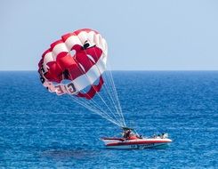 boat with a parachute for leisure activities at sea