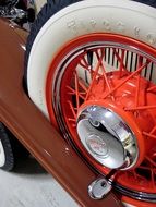 vintage car wheel with whitewall Tire and red rime, Chrysler Sport Coupe