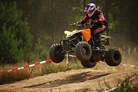 Quad rider Jumping on trace