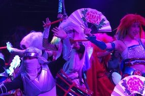 dancers in purple light in japan