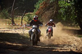 two athletes on a motorcycle on motorcycle races