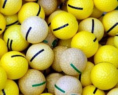 many yellow balls for golf