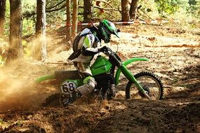 motocross in deep sand among the forest
