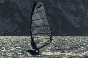 windsurfer on the sea in black and white