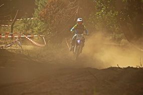 Motorcyclist in the dust on a race track