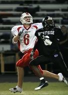 two players in action in american football close-up