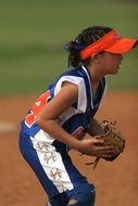 young girl playing softball