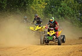 ATV racing in dusty haze