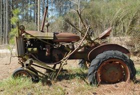 rusty tractor in the village