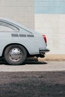 side view of the back of a vintage car