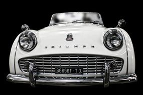white vintage car Triumph