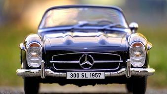 front view of a black 1950s Mercedes in a miniature