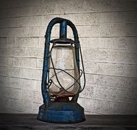 Vintage oil lantern at wall