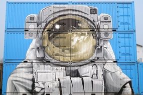drawing of an astronaut on a building wall