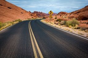 panoramic view of a highway in the desert on a sunny day