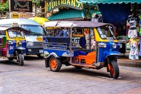 Tuk tuk, Motorcycle Taxi parked on street, Thailand