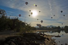 festival of hot air balloons over a lake skinner