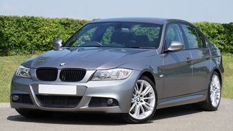 photo of silver luxury car in the bright sun