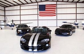 black corvettes on the background of the american flag