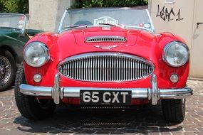 red vintage car in the bright sun