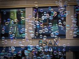 Colorful soap bubbles on a street