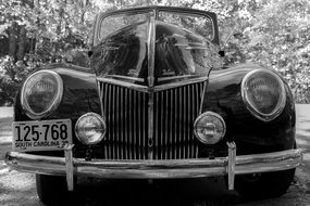 black and white photo of a vintage Ford car