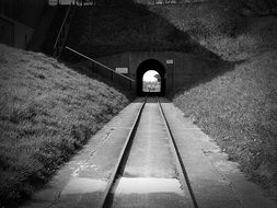 black and white photo of a tram tunnel