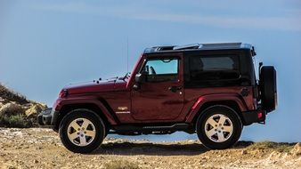 Jeep, new red car at blue sky
